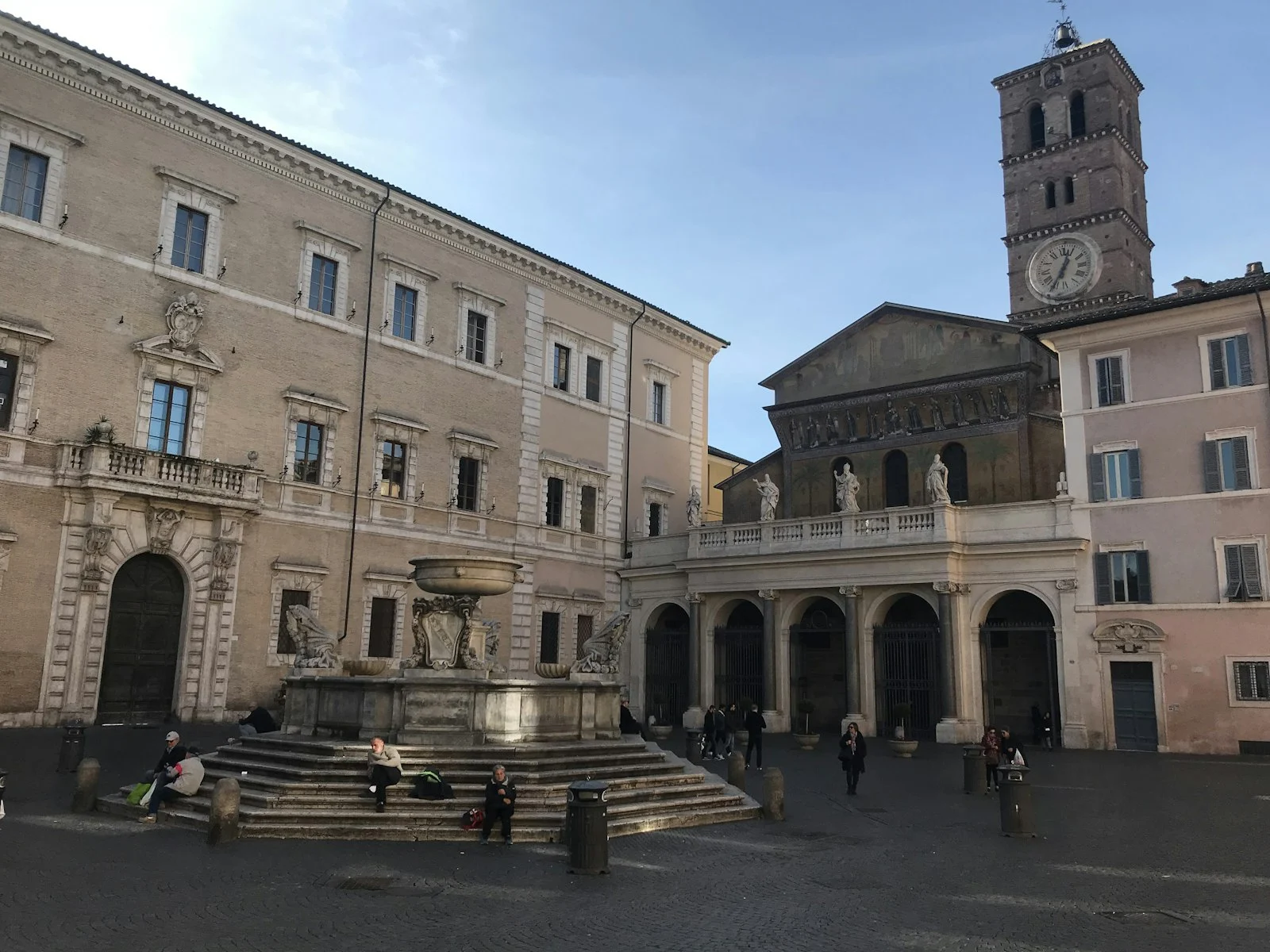 Piazza di Santa Maria in Trastevere with its fountain and basilica
