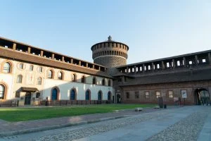 The Sforza Castle in Milan — the inner courtyard of the fortress with its round tower